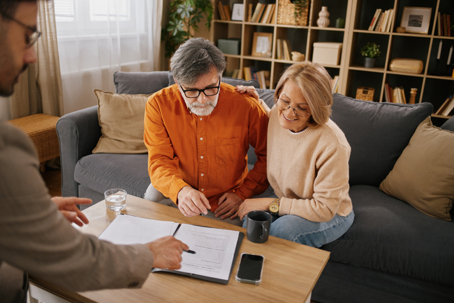 Mature couple reviewing important estate planning documents