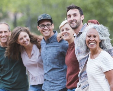 A group of people standing together posing for a picture.