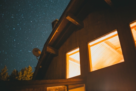 lights on in windows of house at night